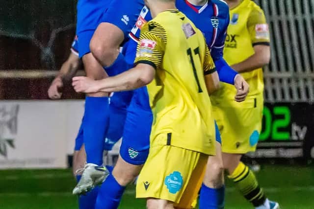 Dan Rowe wins a header for Whitby Town