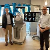 Consultant orthopaedic surgeons Tom Symes and Reza Mayahi with the Mako robotic-arm assisted surgery system. Photo: Spire Hull and East Riding Hospital