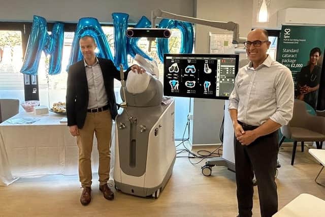 Consultant orthopaedic surgeons Tom Symes and Reza Mayahi with the Mako robotic-arm assisted surgery system. Photo: Spire Hull and East Riding Hospital