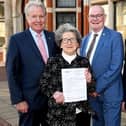 One of the first recipients of the payment, Mrs Muriel Oliver who is seen here with Darryl Stephenson (left), Jonathon Owen (centre) and John Butler, (right)  treasurer of Age UK East Riding.
