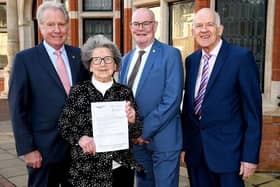 One of the first recipients of the payment, Mrs Muriel Oliver who is seen here with Darryl Stephenson (left), Jonathon Owen (centre) and John Butler, (right)  treasurer of Age UK East Riding.