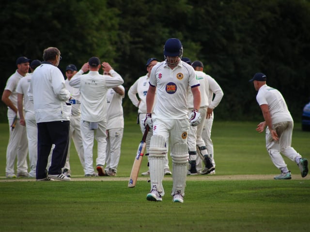 An Ebberston 2nds batsman trudges off.