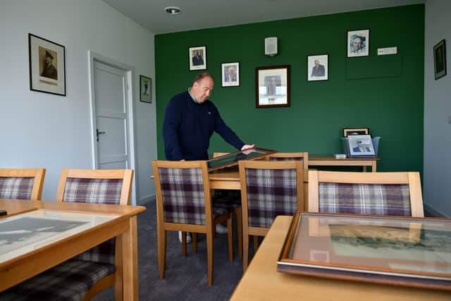 Scarborough Cricket Club committee member Neil Fletcher working on the pictures as part fo the pavilion update. Photo by Richard Ponter