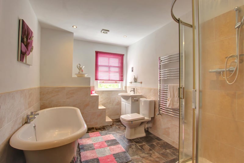 A stylish bathroom with free-standing bath tub.