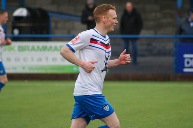Michael Woods has signed a new deal with Whitby Town until the summer of 2026. Photo by Owen Cox