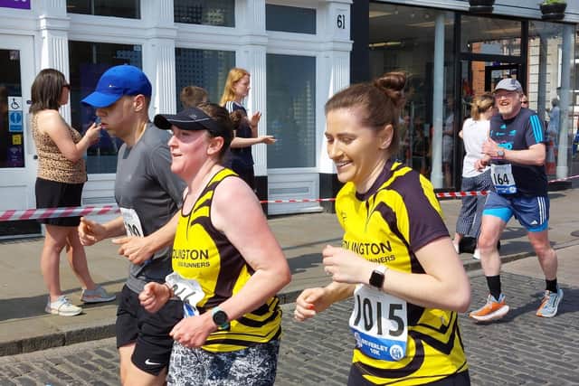 Kirsten Porter, left, runs alongside Cat Moverley at Beverley.