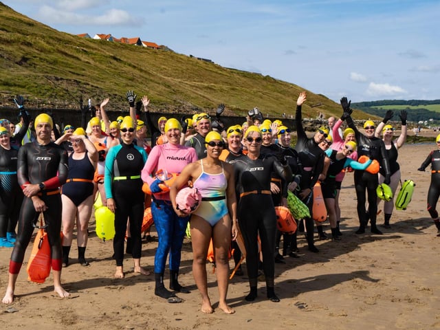 Whitby Wild swimmers on the beach.