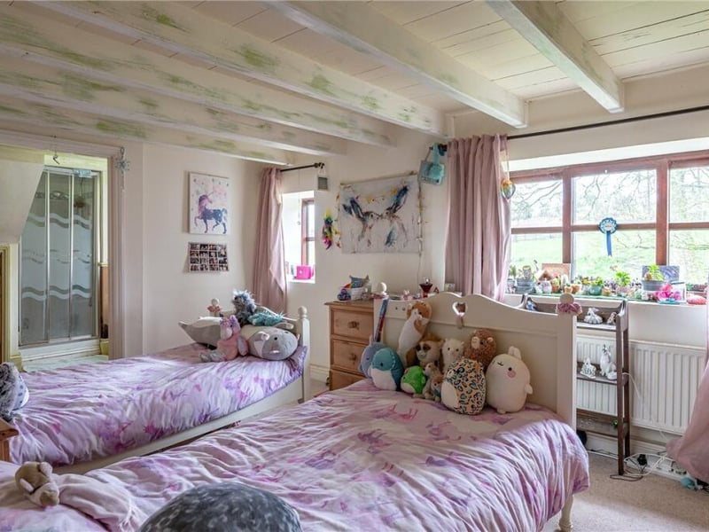 Another of the property's characterful bedrooms.