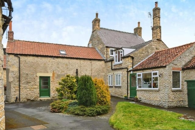A rear view of the stone-built properties.
