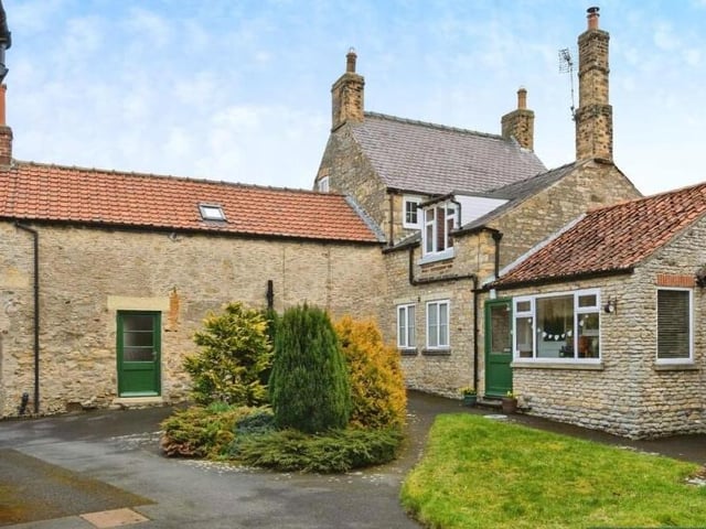 A rear view of the stone-built properties.