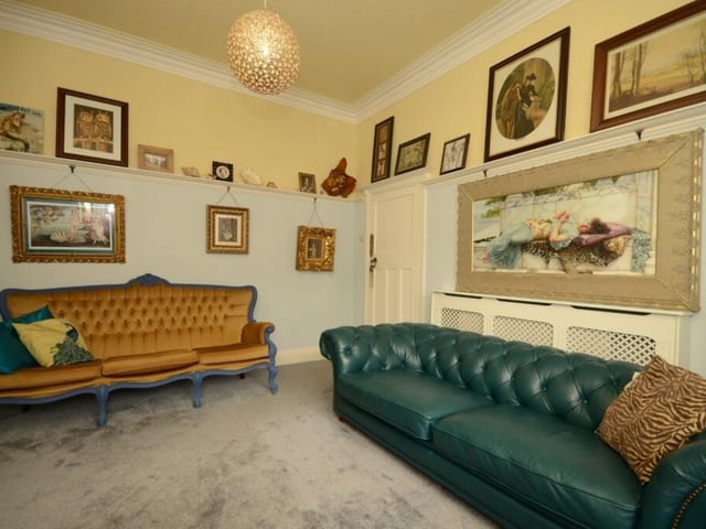 Versatile room space with a picture rail among period decorative detail.