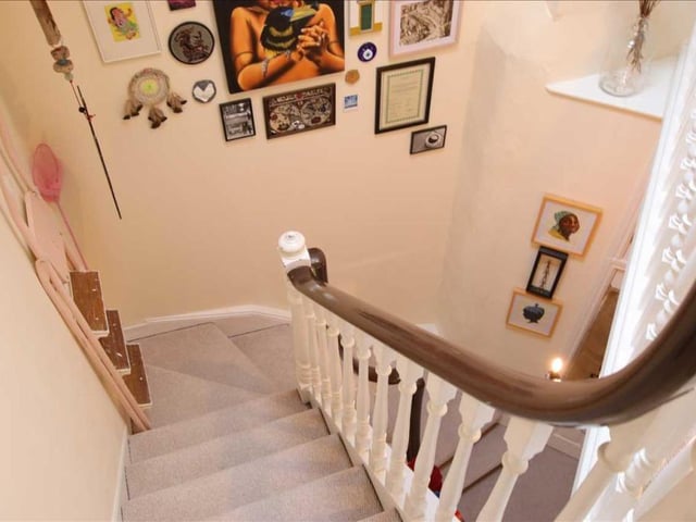 The elegant staircase within the apartment.