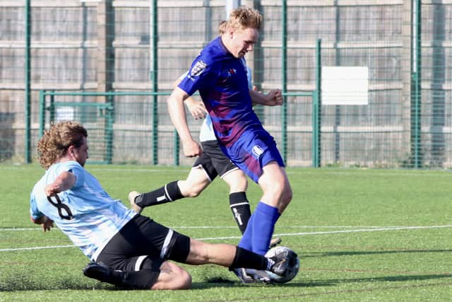 Hessle Rangers Juniors make a sliding challenge against the Pandas.