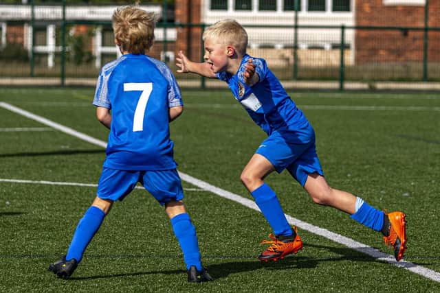 The hosts celebrate another goal. Photo by Brian Murfield