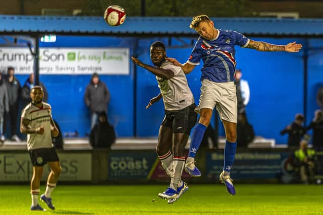 Frankie Whelan wins a header for Whitby in the home win against Hednesford. Photo by Brian Murfield