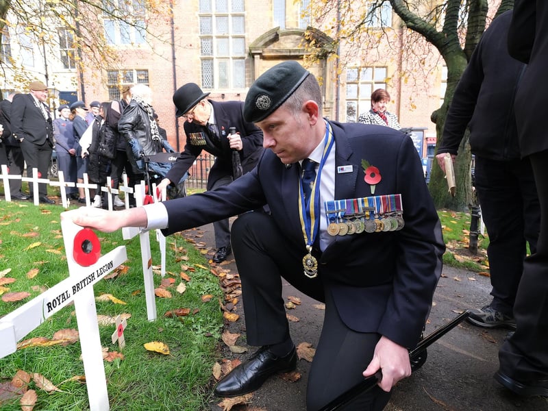 Planting the crosses at the ceremony at Alma Square.