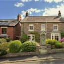 This stone cottage with far-reaching views to front and rear is for sale priced at £560,000.