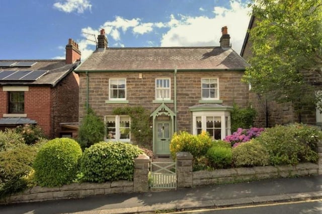 This stone cottage with far-reaching views to front and rear is for sale priced at £560,000.