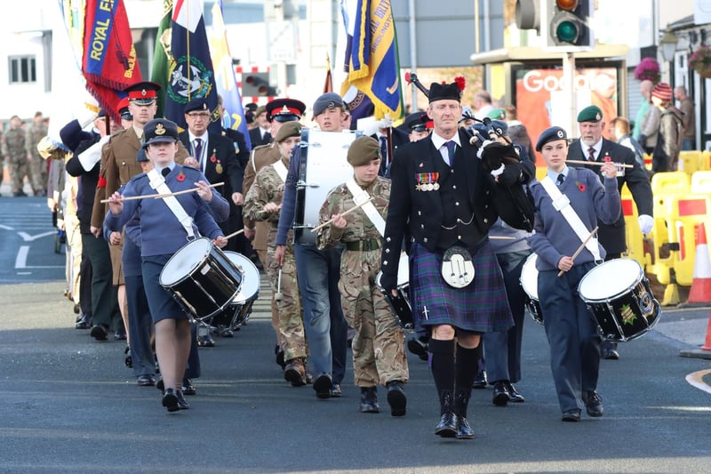The Remembrance Day parade winds its way through town.