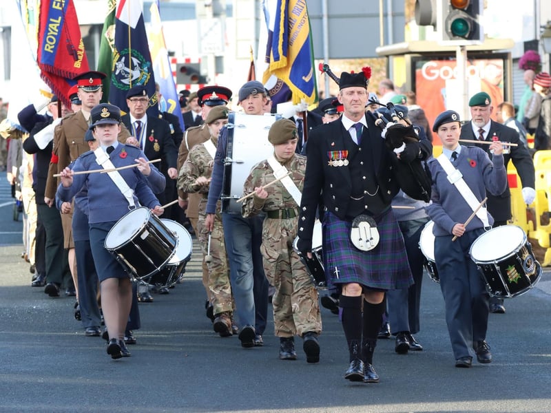 The Remembrance Day parade winds its way through town.
