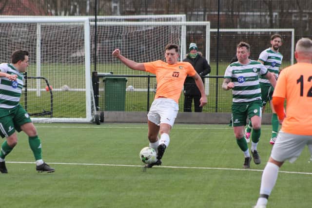 Kieran Link stretches for the ball