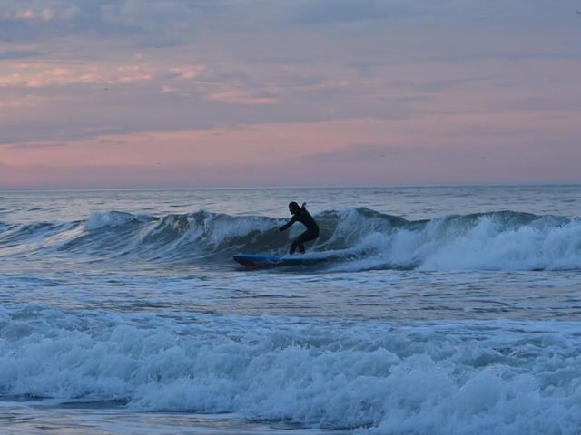 Surfing the waves at Scarborough, by Barbara Bateman.