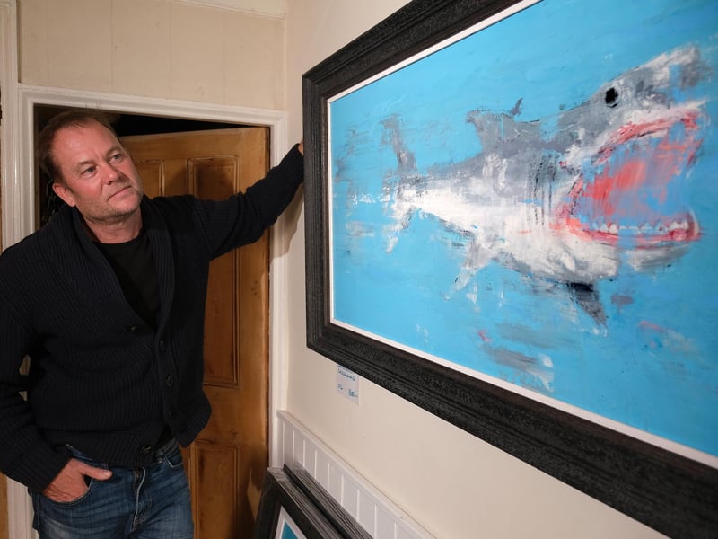 Artist Rob Shaw with his Great White Shark painting.