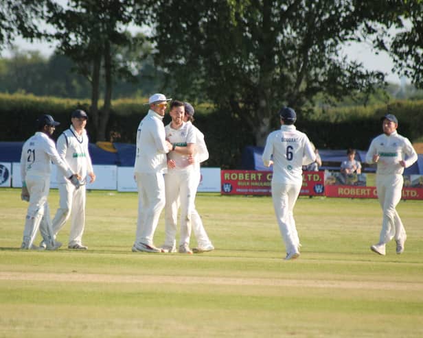 Freddie Collins is congratulated by his Woodhouse teammates against Driffield before they were pipped at the post by the visitors.