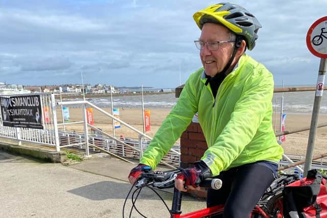 David Butland on his bike on the seafront in Bridlington