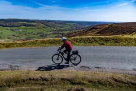 A cyclist descends one of Yorkshire cycling hot spots in the North Yorks Moors National Park