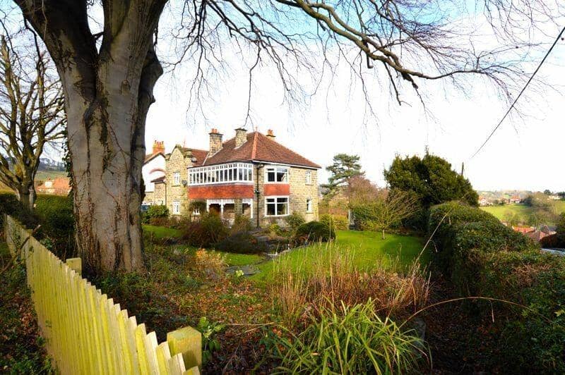 The Sleights property stands within wrap-around gardens.