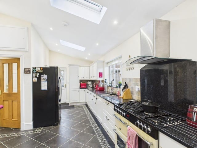 The well equipped kitchen has plenty of workspace.