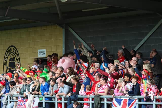 The Boro fans, many in fancy dress, cheer on the visitors.