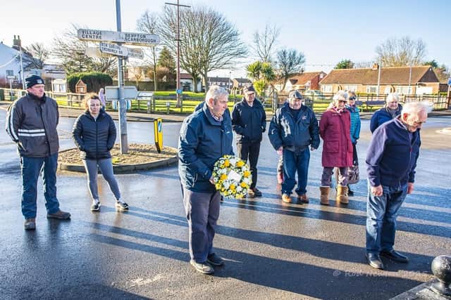 Wreaths were laid by Malcolm Smales, on behalf of the Flamborough Fishermen's Memorial Group, and by Councillor Vic Leppington, on behalf of the Flamborough Parish Council. Photo: Rod Newton