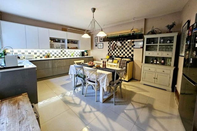 The dining kitchen has fitted units and an Aga cooker.