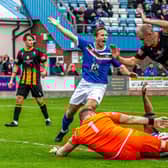 Town's Adam Gell appeals for a penalty with Junior Mondal floored, the spot-kick was awarded and Jacob Gratton converted to earn a 1-0 win.