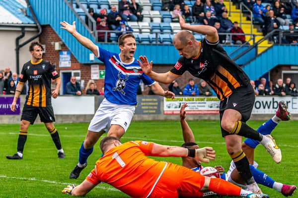 Town's Adam Gell appeals for a penalty with Junior Mondal floored, the spot-kick was awarded and Jacob Gratton converted to earn a 1-0 win.