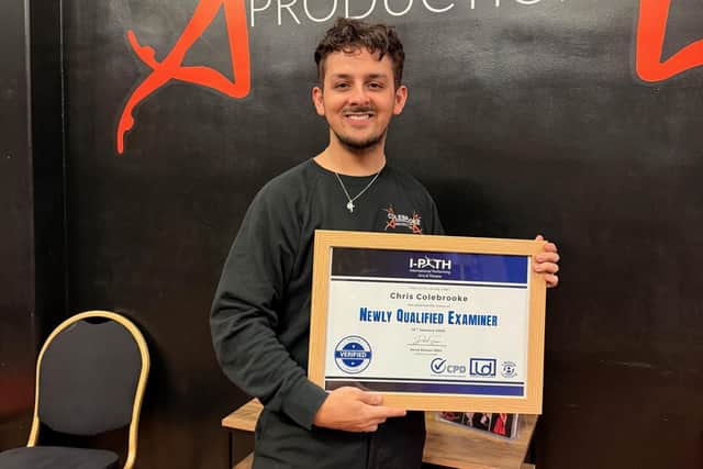 Chris Colebrooke, with his examiner certificate. photo: Paul Armstrong, the Artistic Lens