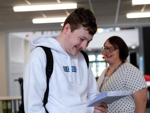 Rylan Broom studies his results as head of science Janine Wade looks on.
Rylan will go on to study Maths at the University of Hull.
