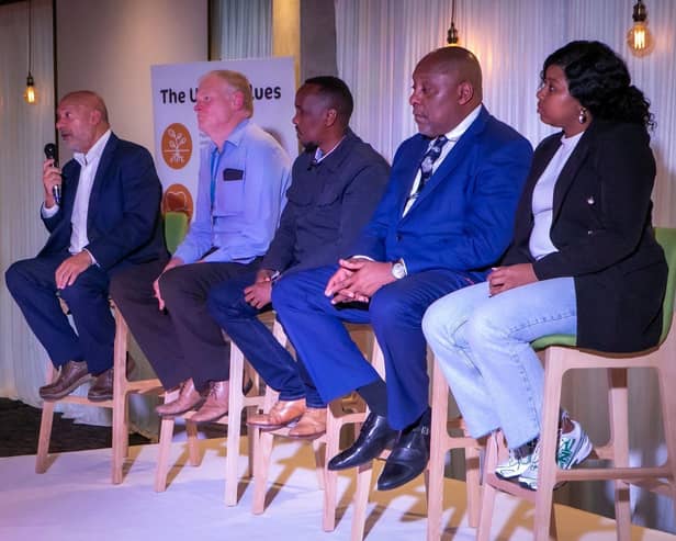 Former Unity Homes and Enterprise chief executive Ali Akbor OBE (left) addressing its Annual General Meeting, alongside Phil Cole, Jamal Tahlil, Patrick Bernard and Saskia Fishley