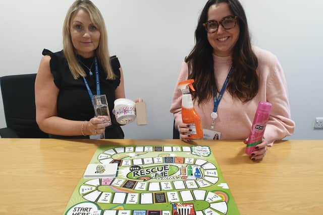 Michelle Bailes, left, and Ariane Heap get ready to introduce the board game to schools.