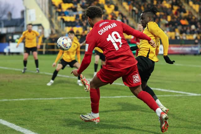 Theo Chapman puts a home player under pressure. Photo by Disport Photography