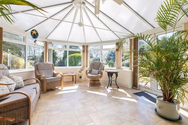 A versatile sun room with doors out to the garden.