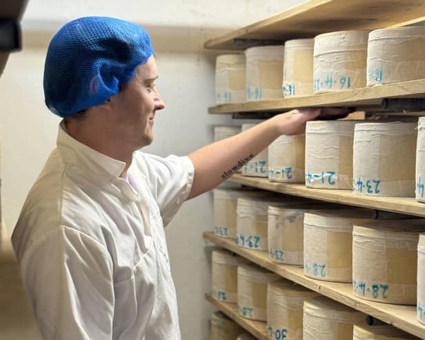 Stocking cheese at Botton creamery.