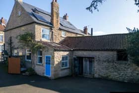 A view of the period farmhouse in Snainton, with the stone barn to the rear.