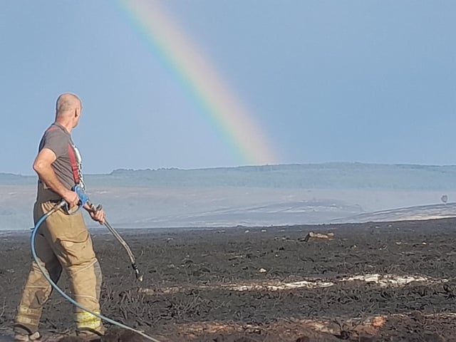 A rainbow boosting the morale of the crews tackling the blaze.