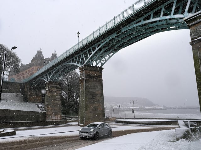 Snow falling on South Bay