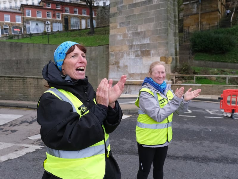Marshalls cheer on the runners.