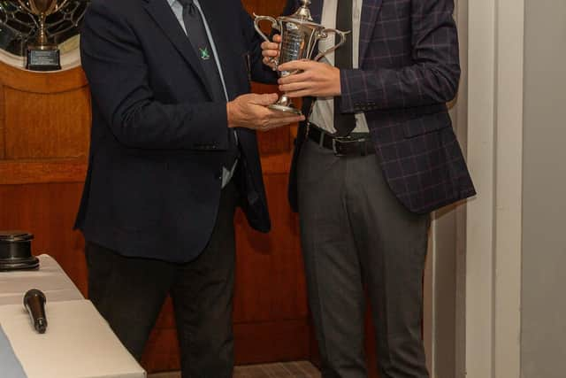 North Cliff GC captain Tomy Brown presents Tom Benson with the Club Championship Gibson Cup.