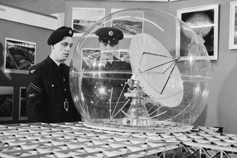 Unspecified military personnel inspect a model of the Ballistic Missile Early Warning System (BMEWS) on display at the Air Ministry exhibition in Whitehall, London, England, May 21 1962. Later that year, BMEWS was installed at RAF Fylingdales on the North York Moors.